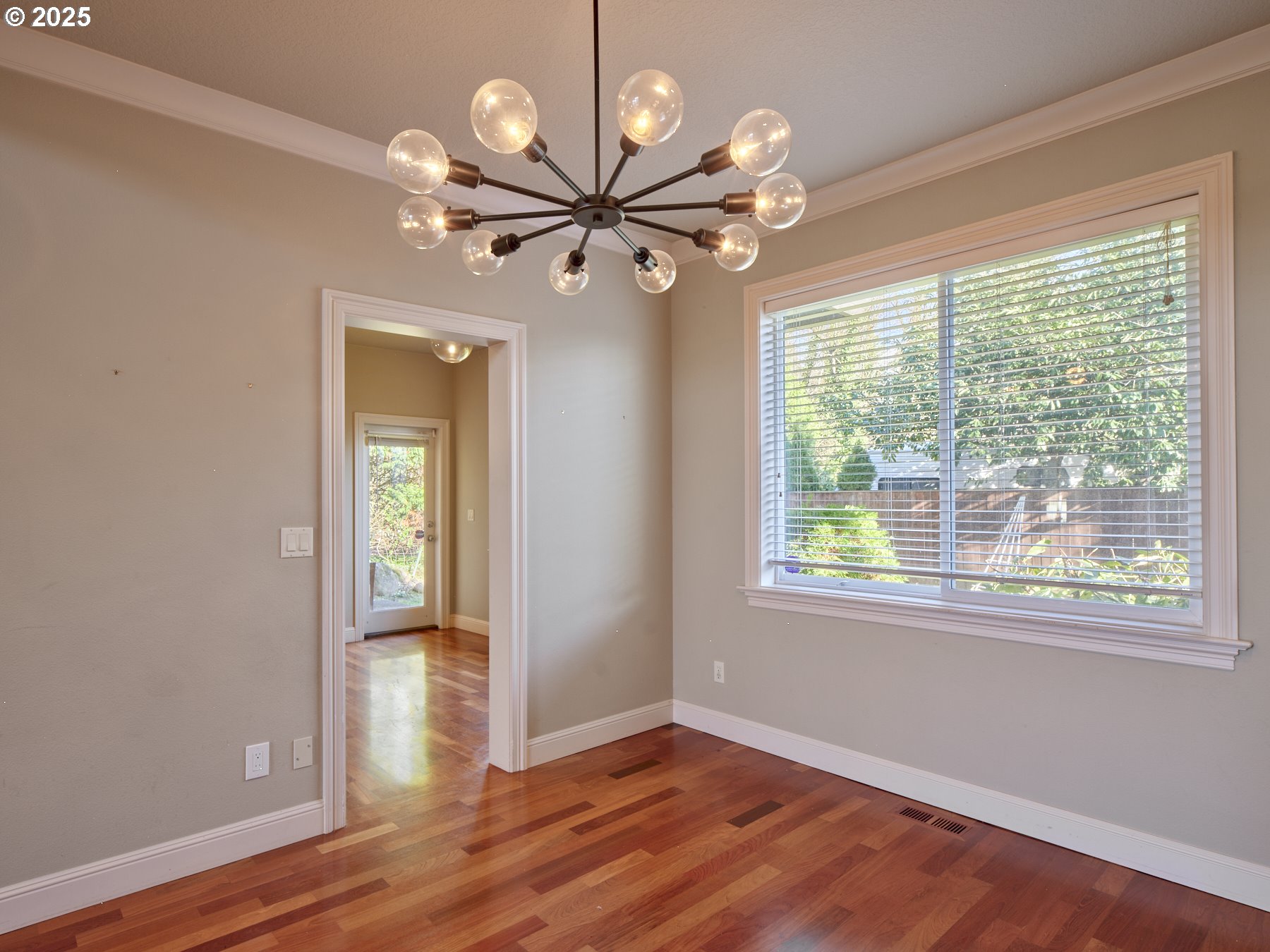 10410 Southeast French Road Vancouver, WA 98664 - Photo 9 of 43 a view of an empty room with a window and wooden floor