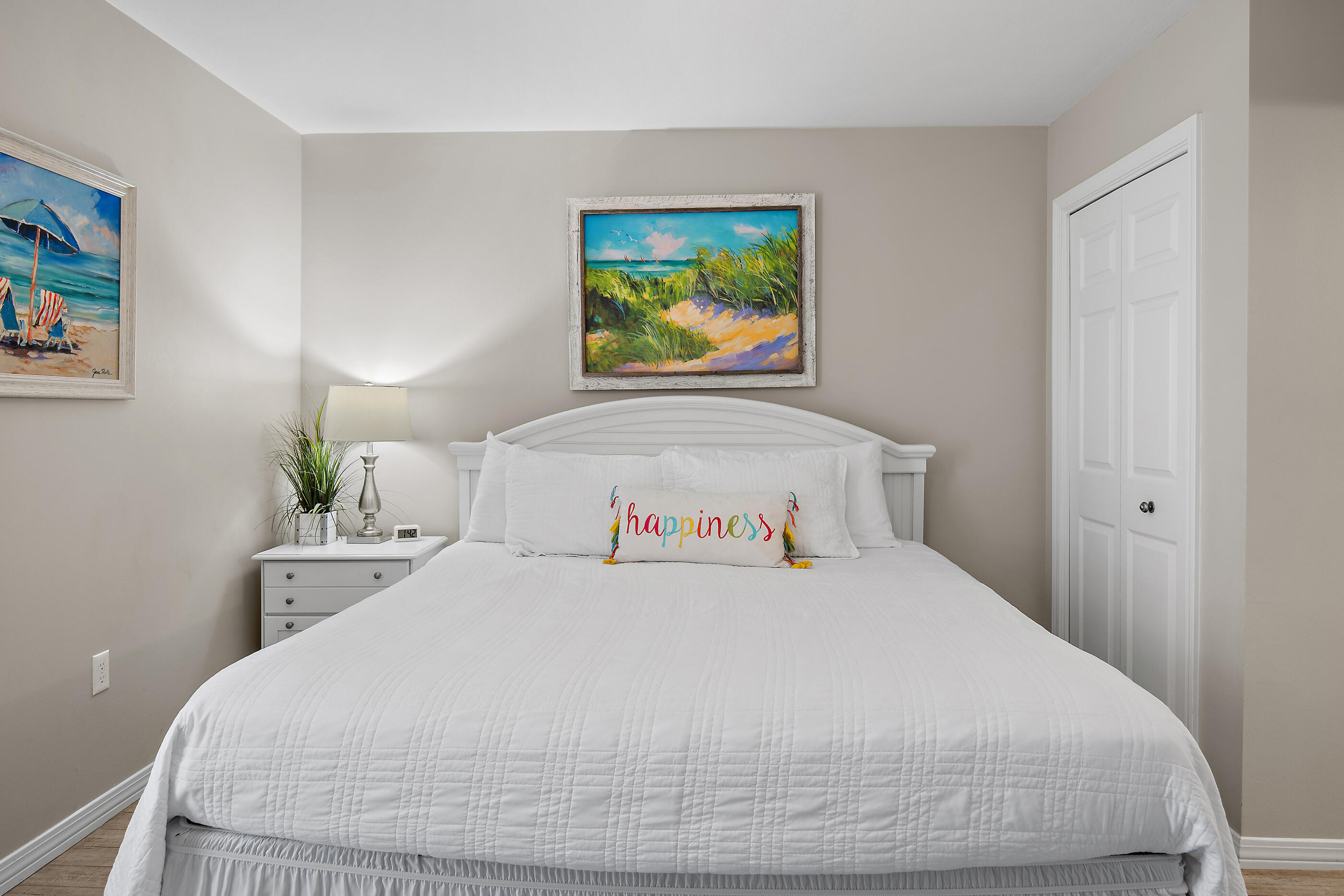 144 Spires Lane, Unit 107 Santa Rosa Beach, FL 32459 - Photo 11 of 34 a bedroom with a bed and painting on the wall