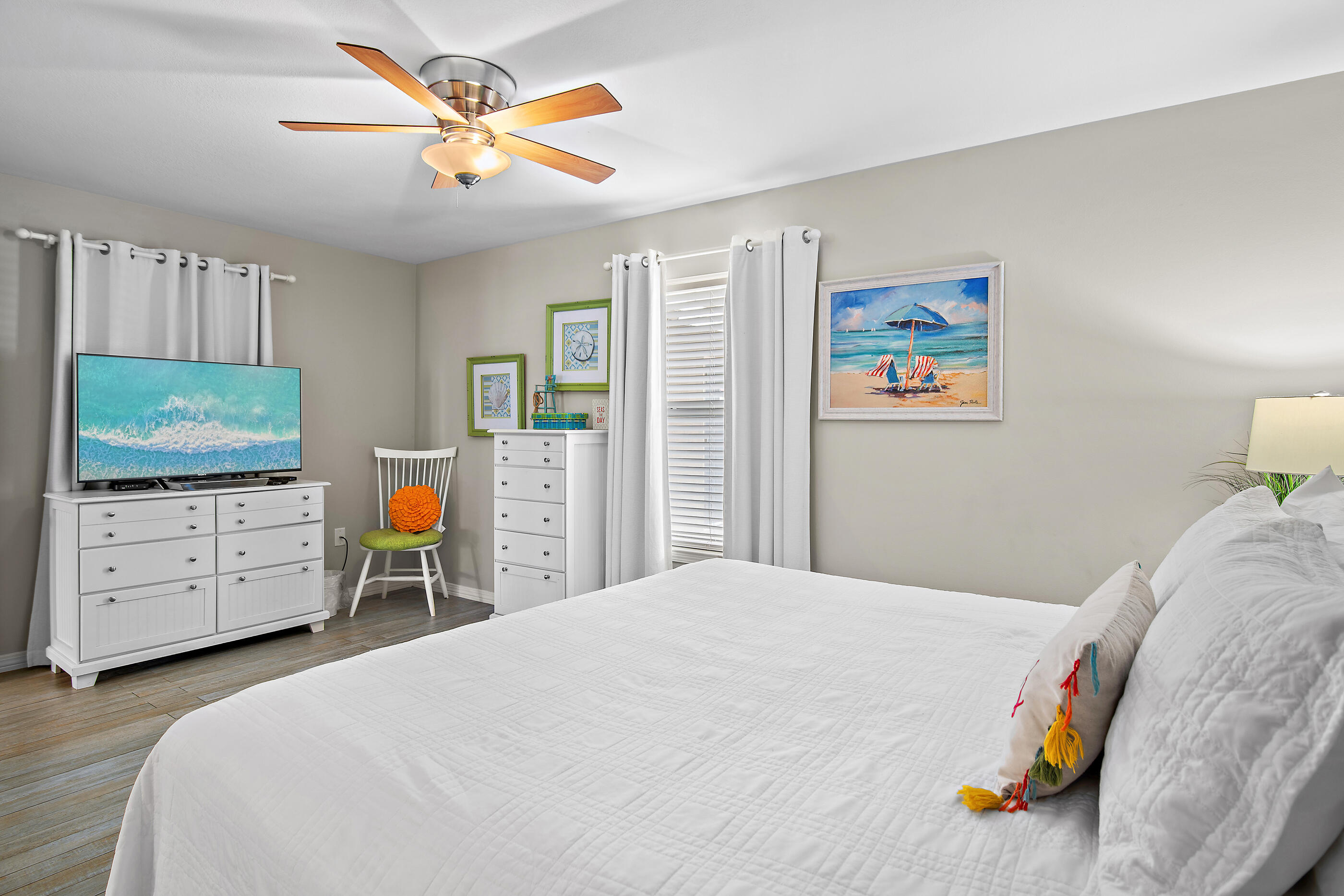 144 Spires Lane, Unit 107 Santa Rosa Beach, FL 32459 - Photo 13 of 34 a bedroom with a bed and a flat screen tv