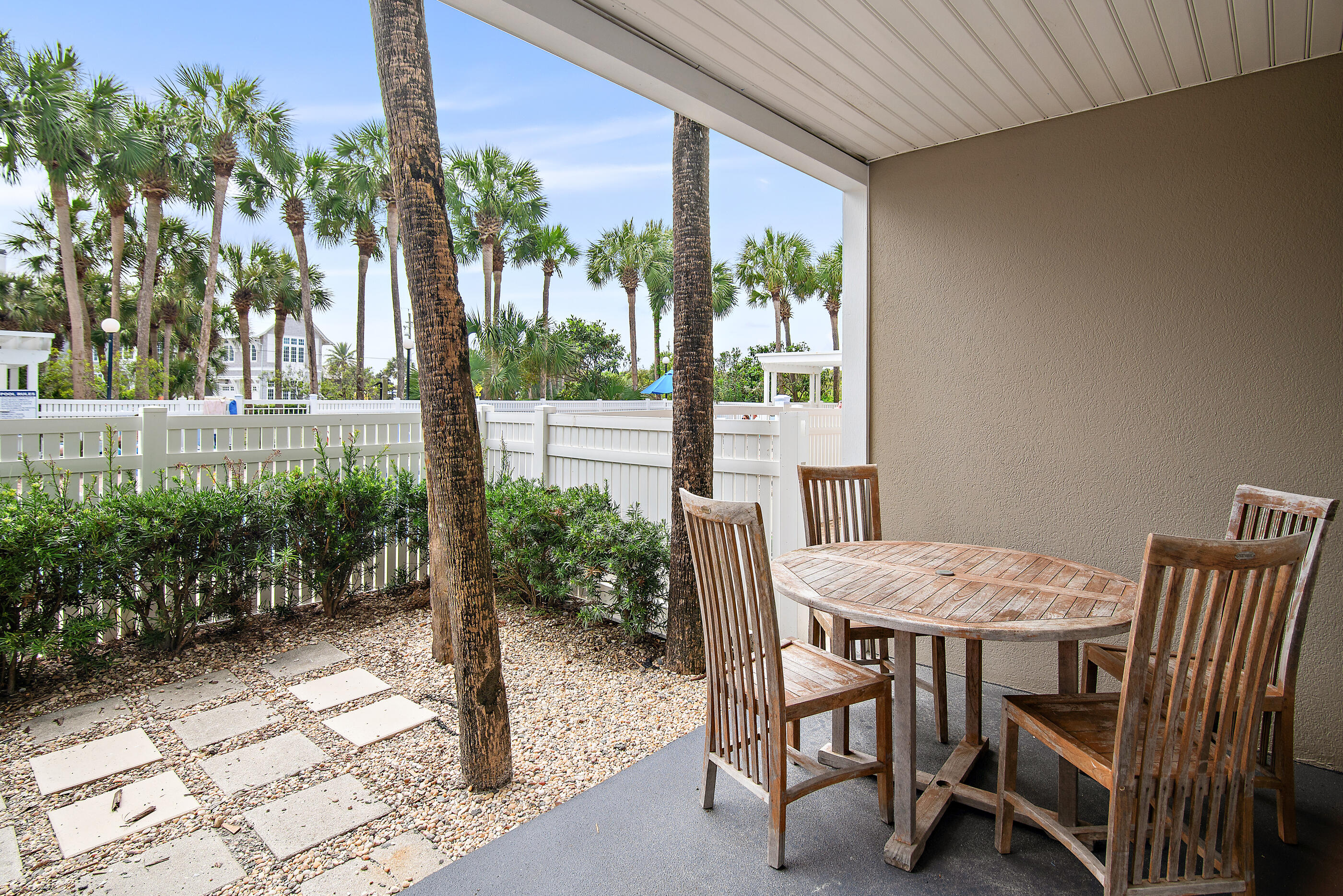 144 Spires Lane, Unit 107 Santa Rosa Beach, FL 32459 - Photo 16 of 34 a view of a dining room with furniture and a yard