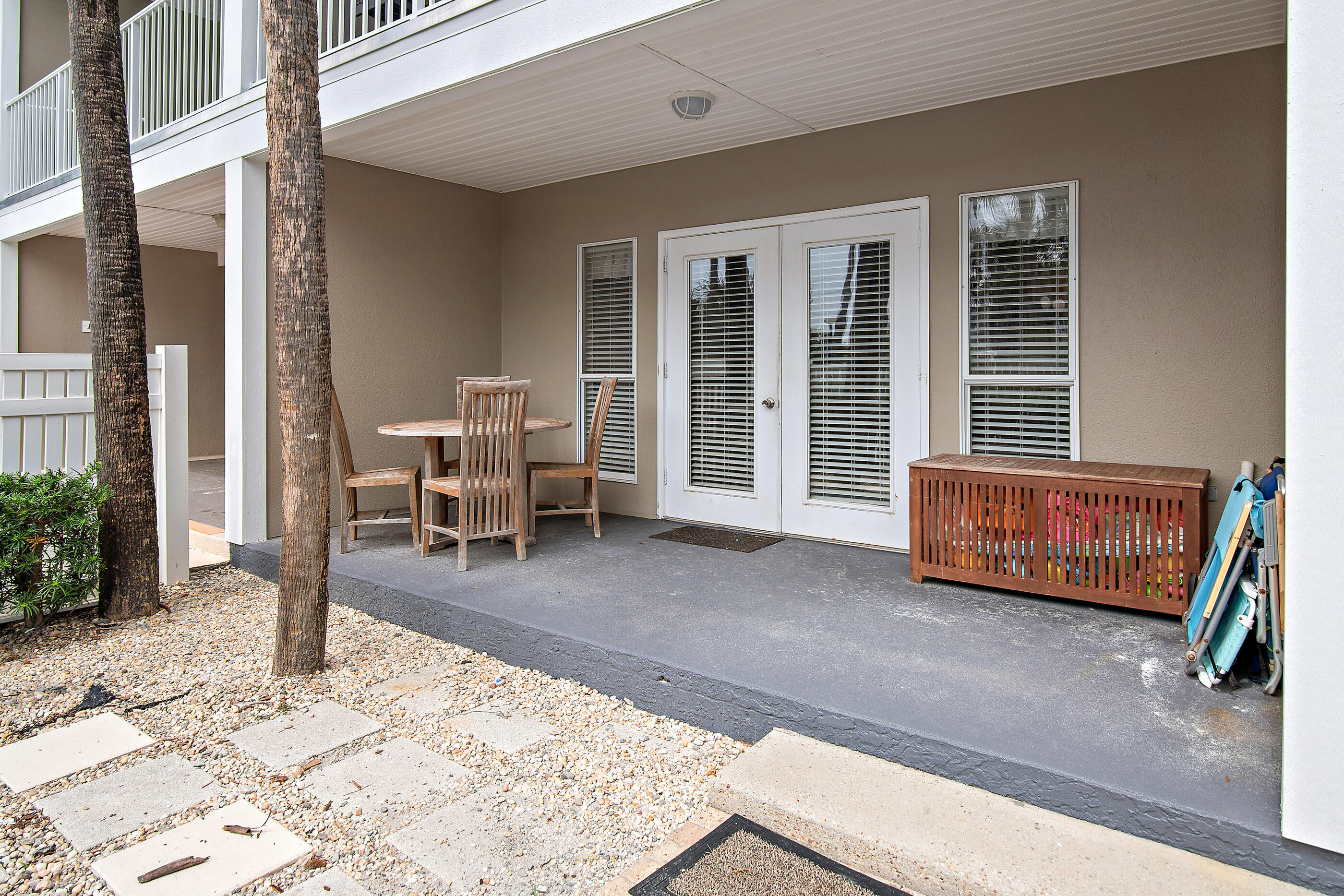 144 Spires Lane, Unit 107 Santa Rosa Beach, FL 32459 - Photo 18 of 34 a living room with couch chairs and a dining table