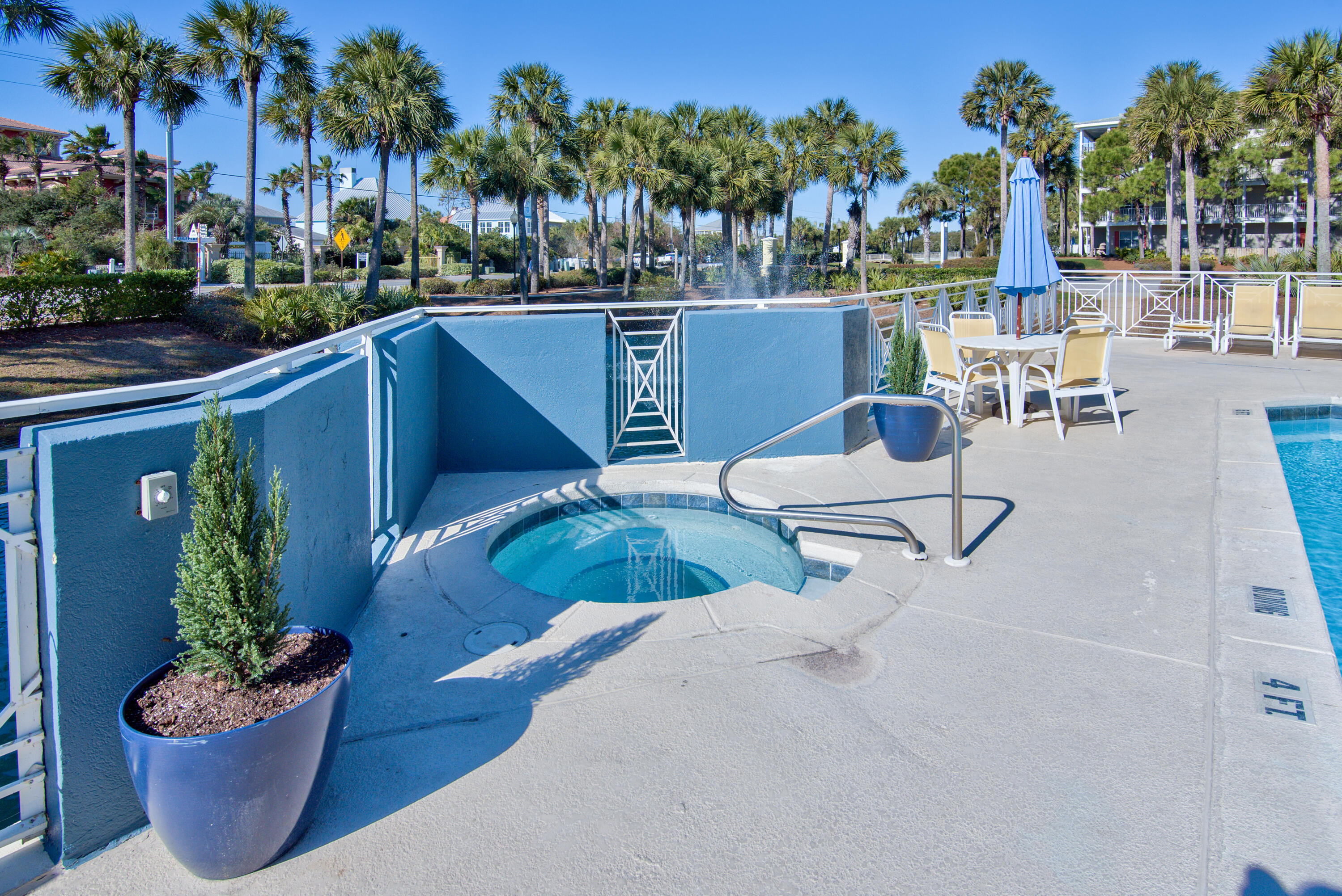 144 Spires Lane, Unit 107 Santa Rosa Beach, FL 32459 - Photo 22 of 34 a view of a backyard with plants and chairs