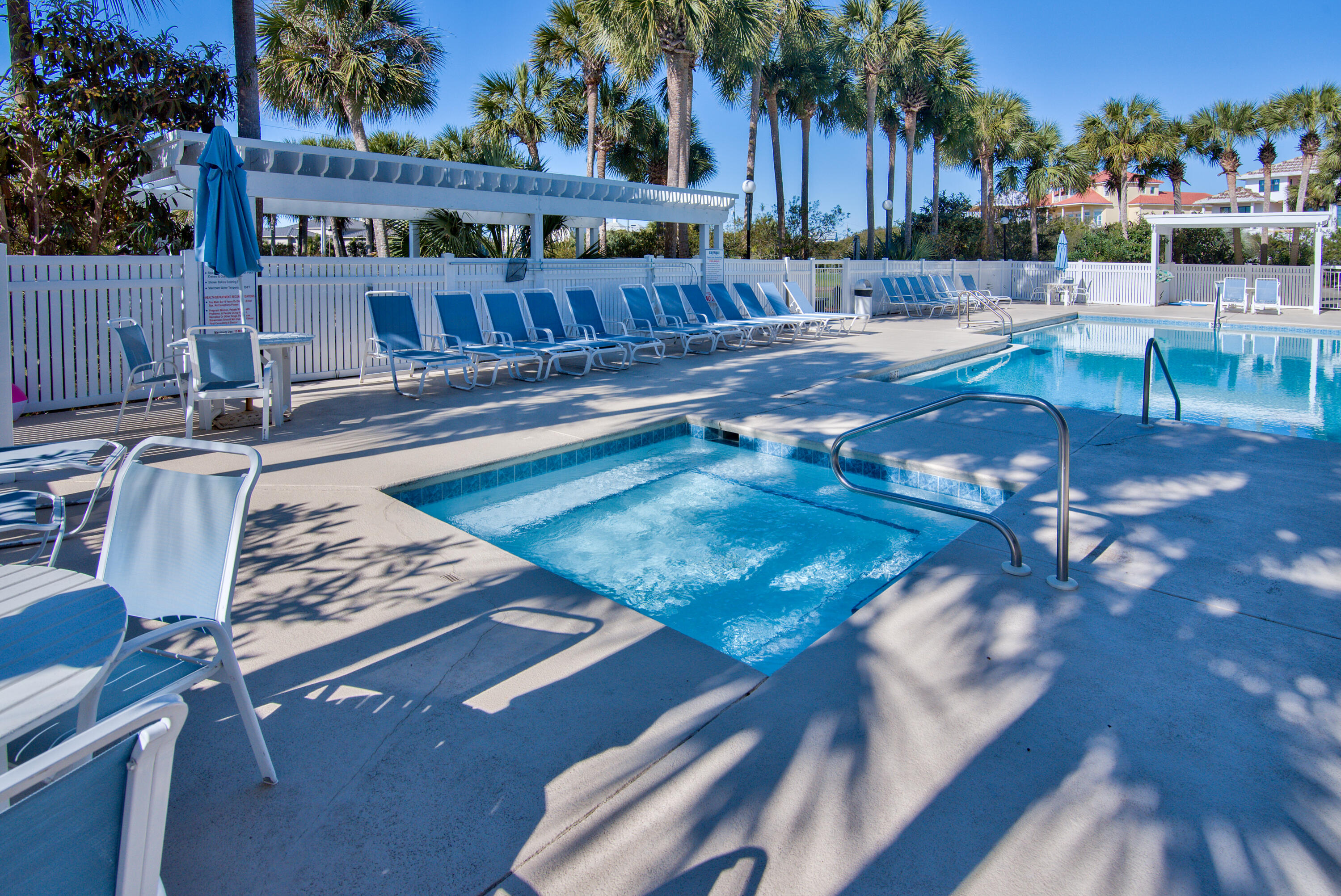 144 Spires Lane, Unit 107 Santa Rosa Beach, FL 32459 - Photo 26 of 34 a view of a swimming pool with patio and a yard