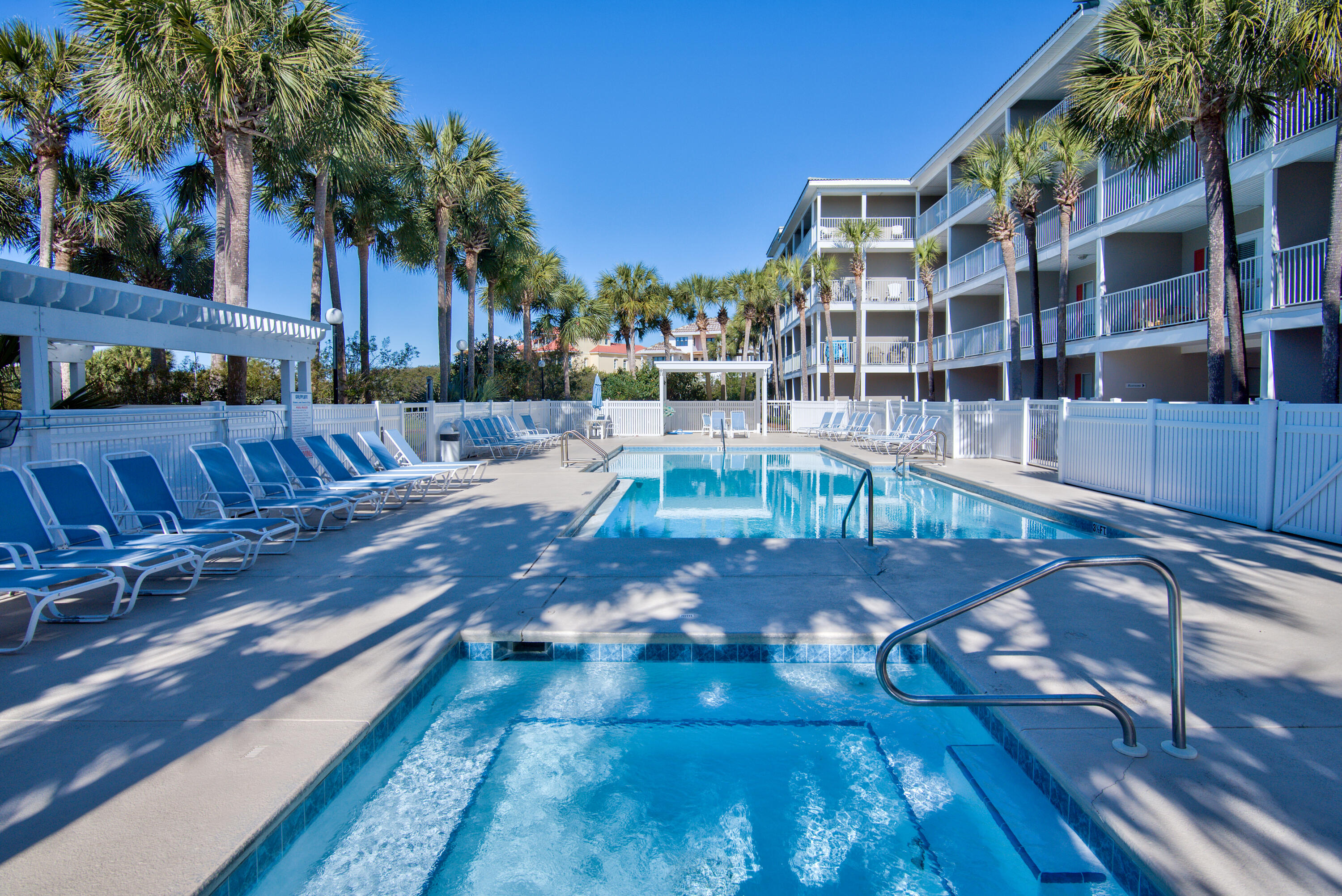 144 Spires Lane, Unit 107 Santa Rosa Beach, FL 32459 - Photo 27 of 34 a view of a swimming pool with outdoor seating and plants
