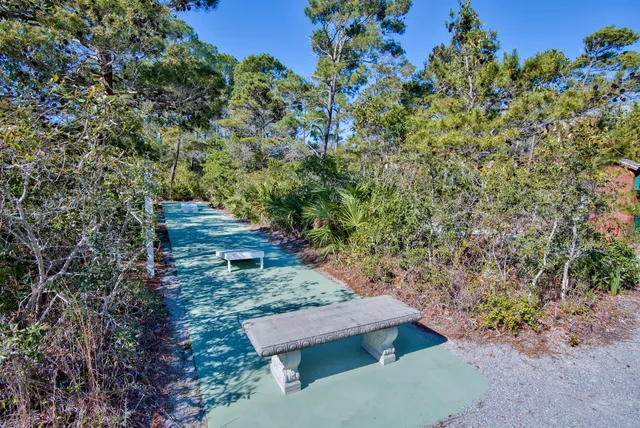 a view of a backyard with sitting area