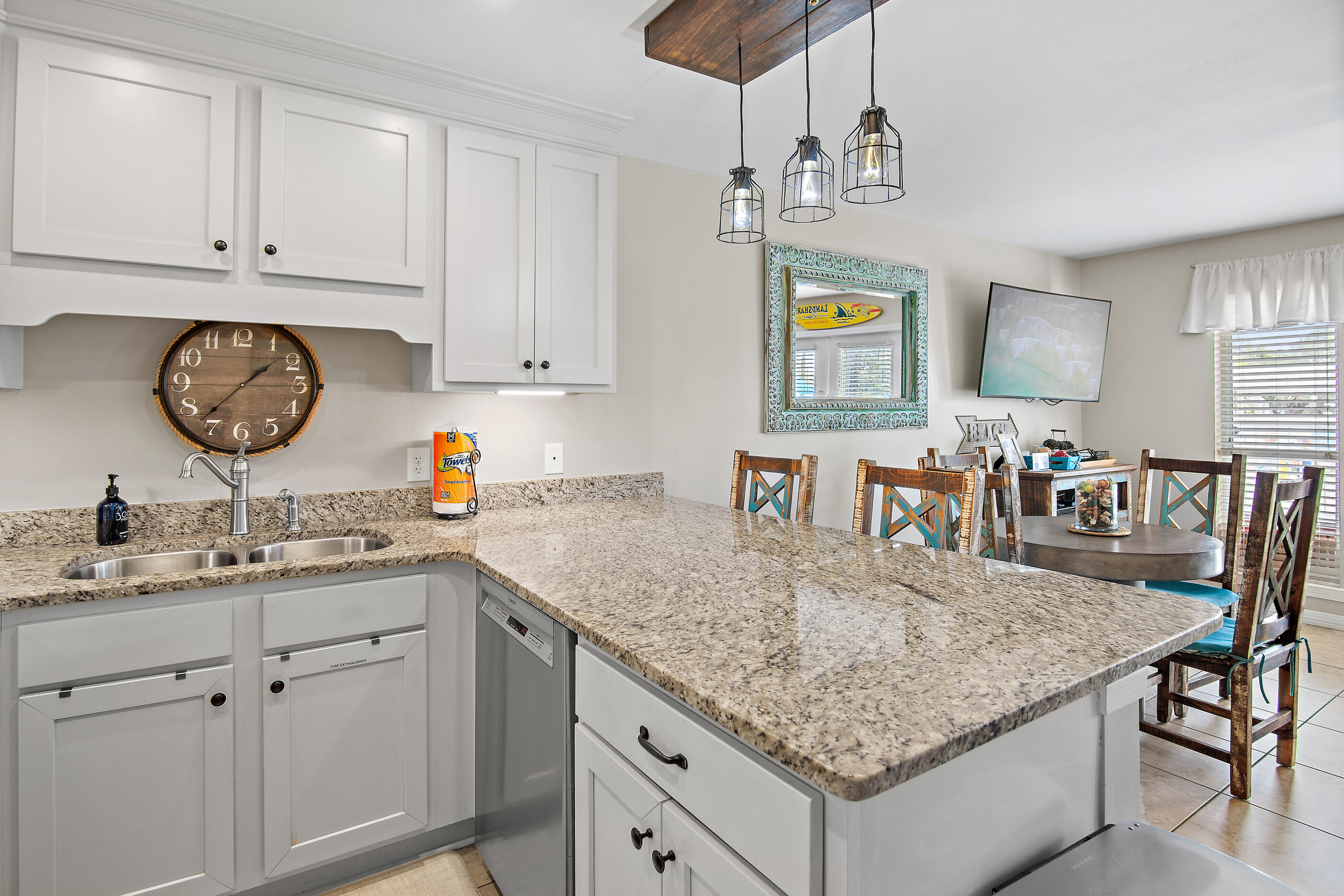 144 Spires Lane, Unit 107 Santa Rosa Beach, FL 32459 - Photo 3 of 34 a view of center island cabinets furniture and chandelier