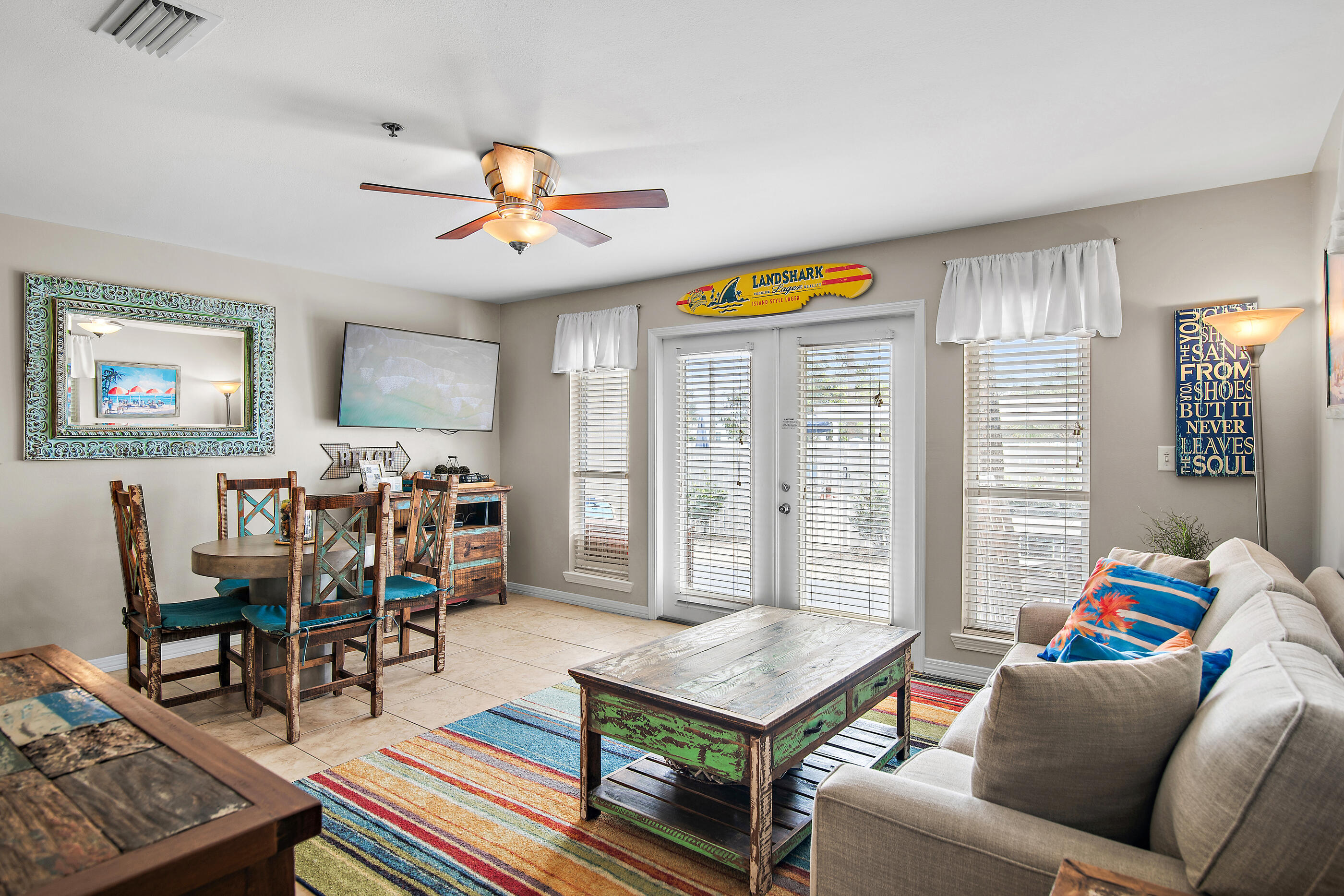144 Spires Lane, Unit 107 Santa Rosa Beach, FL 32459 - Photo 4 of 34 a living room with furniture and a dining table