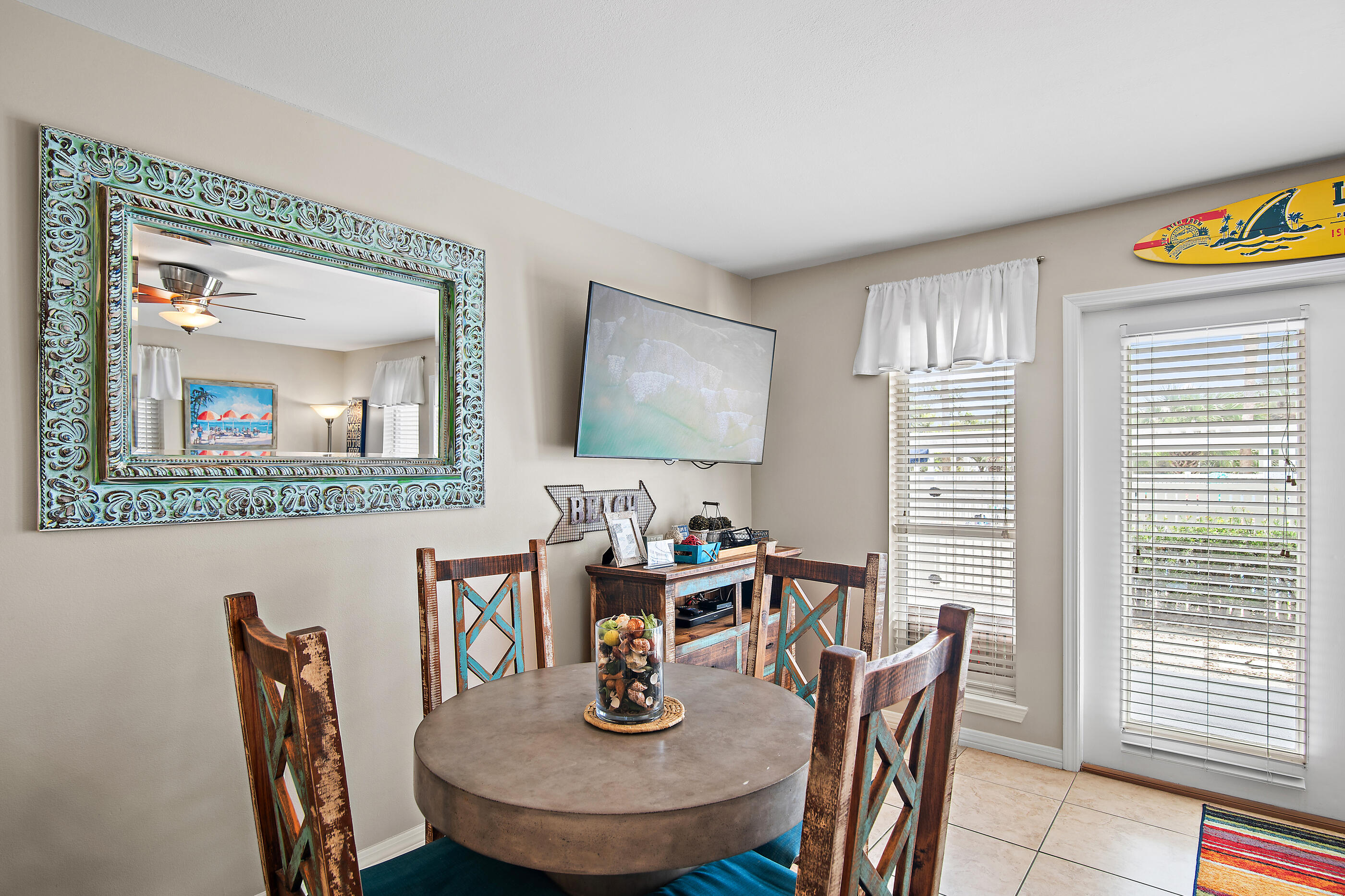 144 Spires Lane, Unit 107 Santa Rosa Beach, FL 32459 - Photo 7 of 34 a dining room with furniture and wooden floor