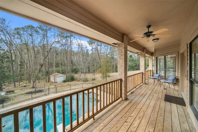 a view of a balcony with wooden floor