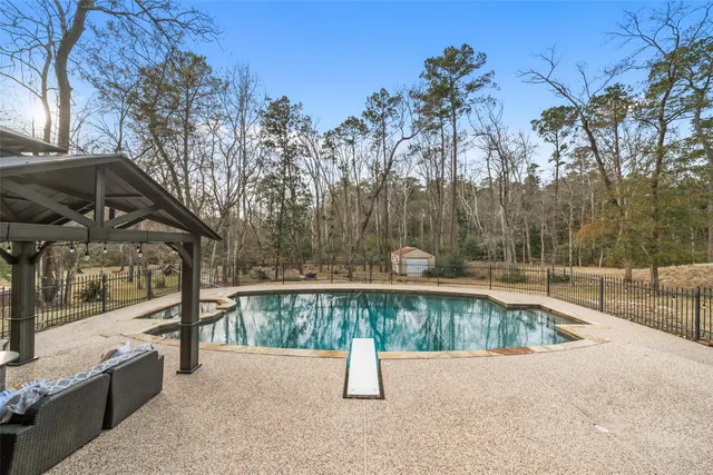 a view of a swimming pool with a patio