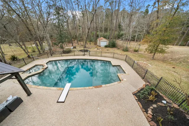 a view of a swimming pool with a patio