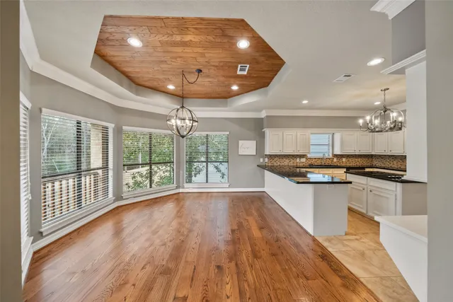 a open kitchen with stainless steel appliances granite countertop a stove and refrigerator