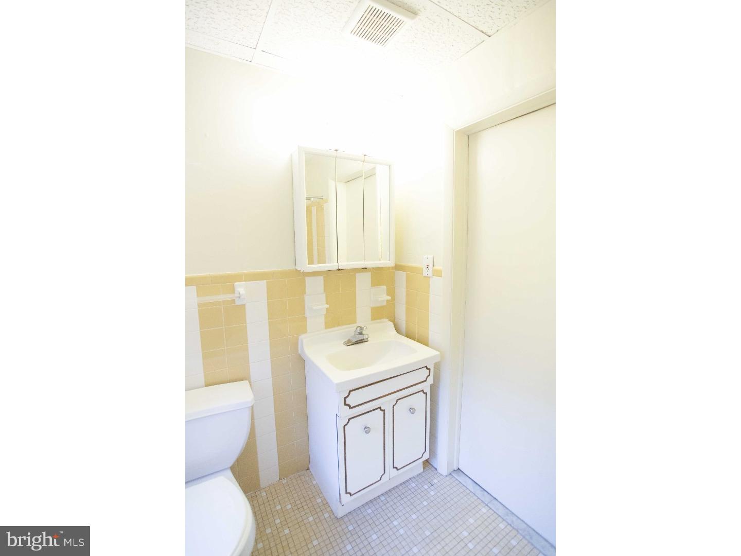 901 Clinton Street, Unit 1 Philadelphia, PA 19107 - Photo 14 of 23 a bathroom with a sink a toilet and mirror
