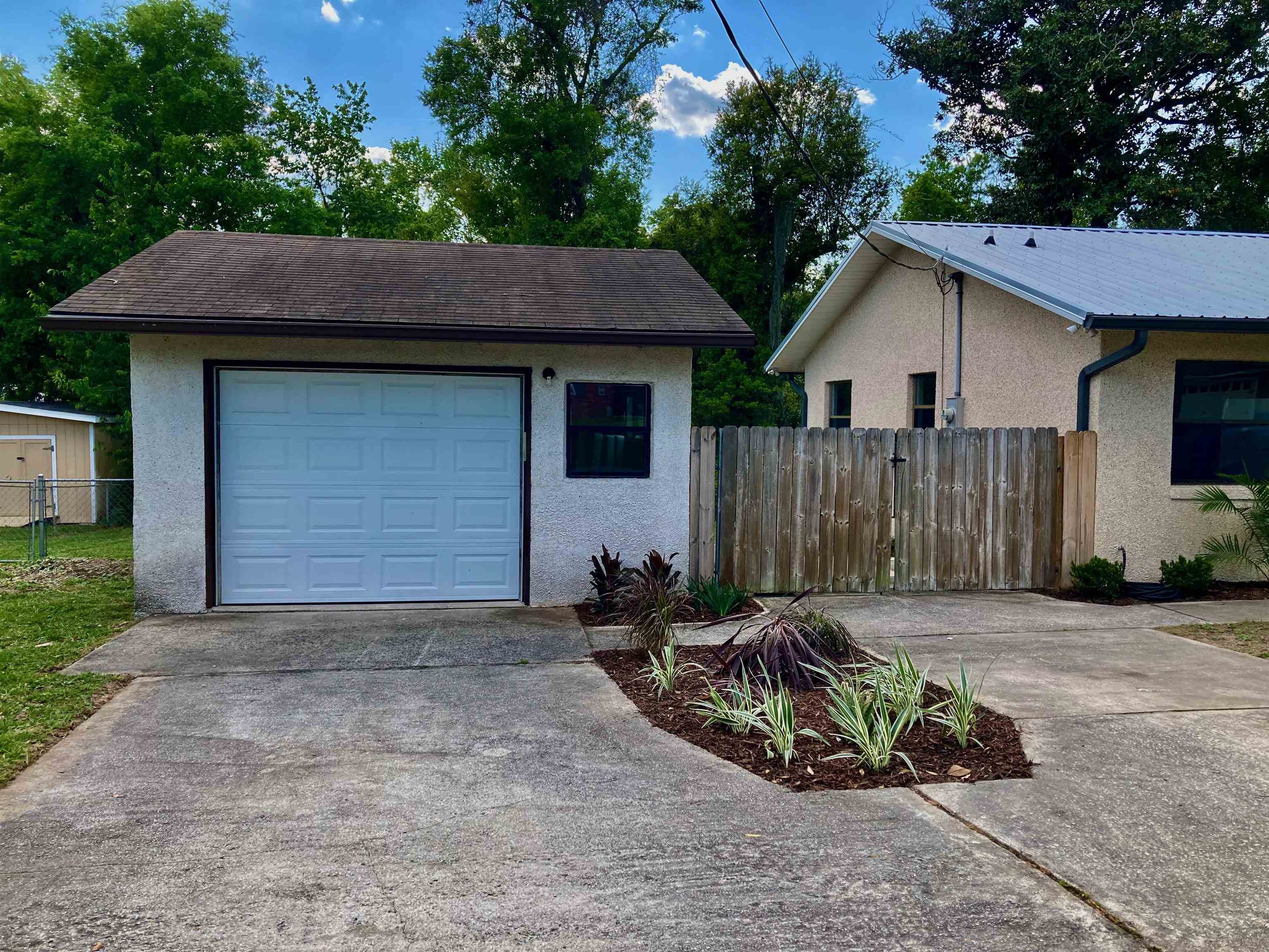 356 Cypress Road St. Augustine, FL 32086 - Photo 2 of 40 a view of a small house with garage
