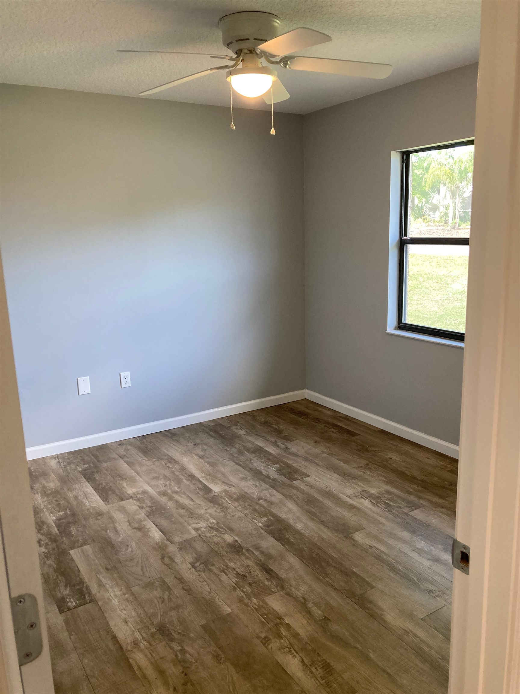 356 Cypress Road St. Augustine, FL 32086 - Photo 22 of 40 an empty room with a ceiling fan and window