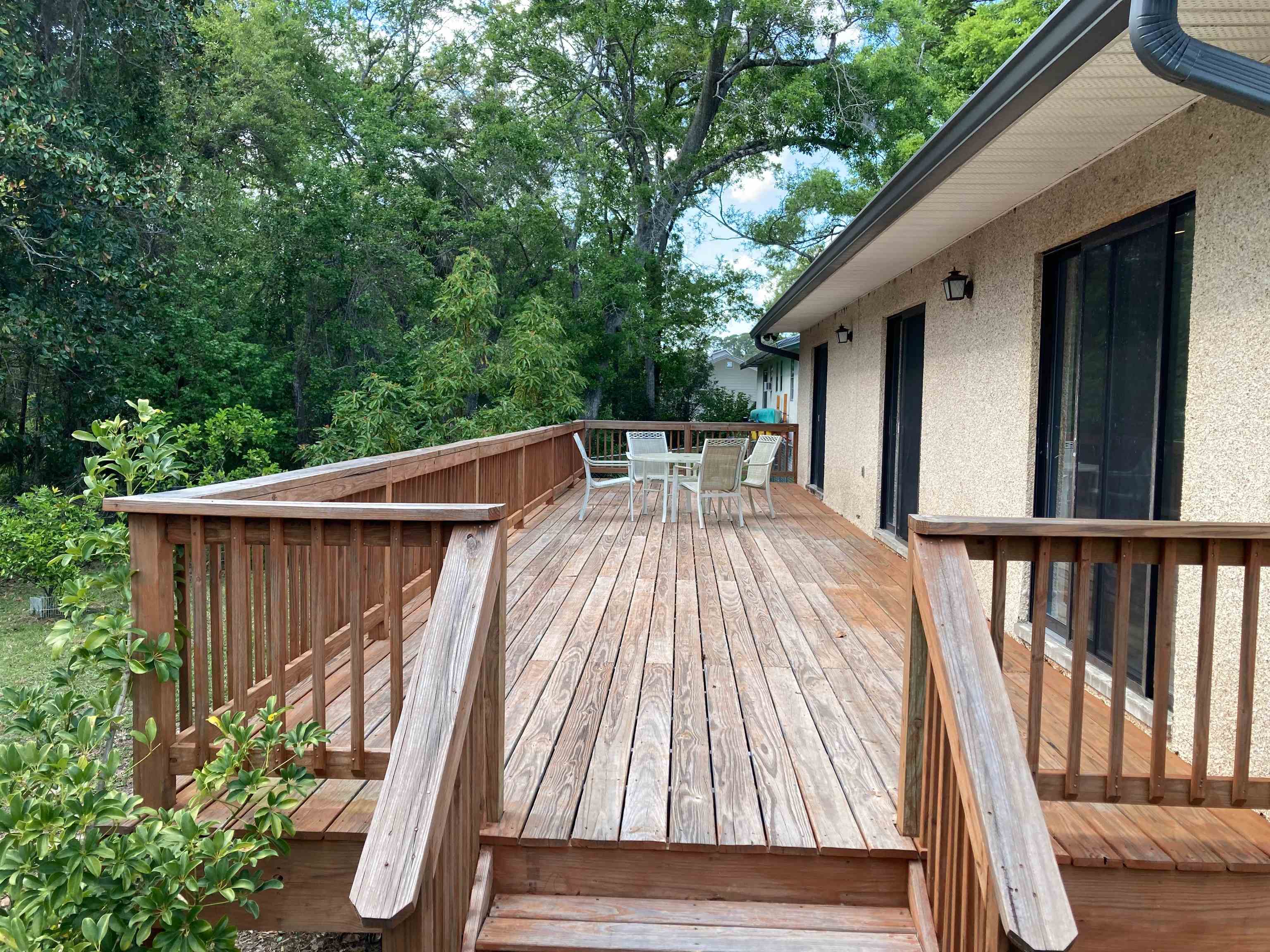 356 Cypress Road St. Augustine, FL 32086 - Photo 31 of 40 a view of backyard with deck and garden