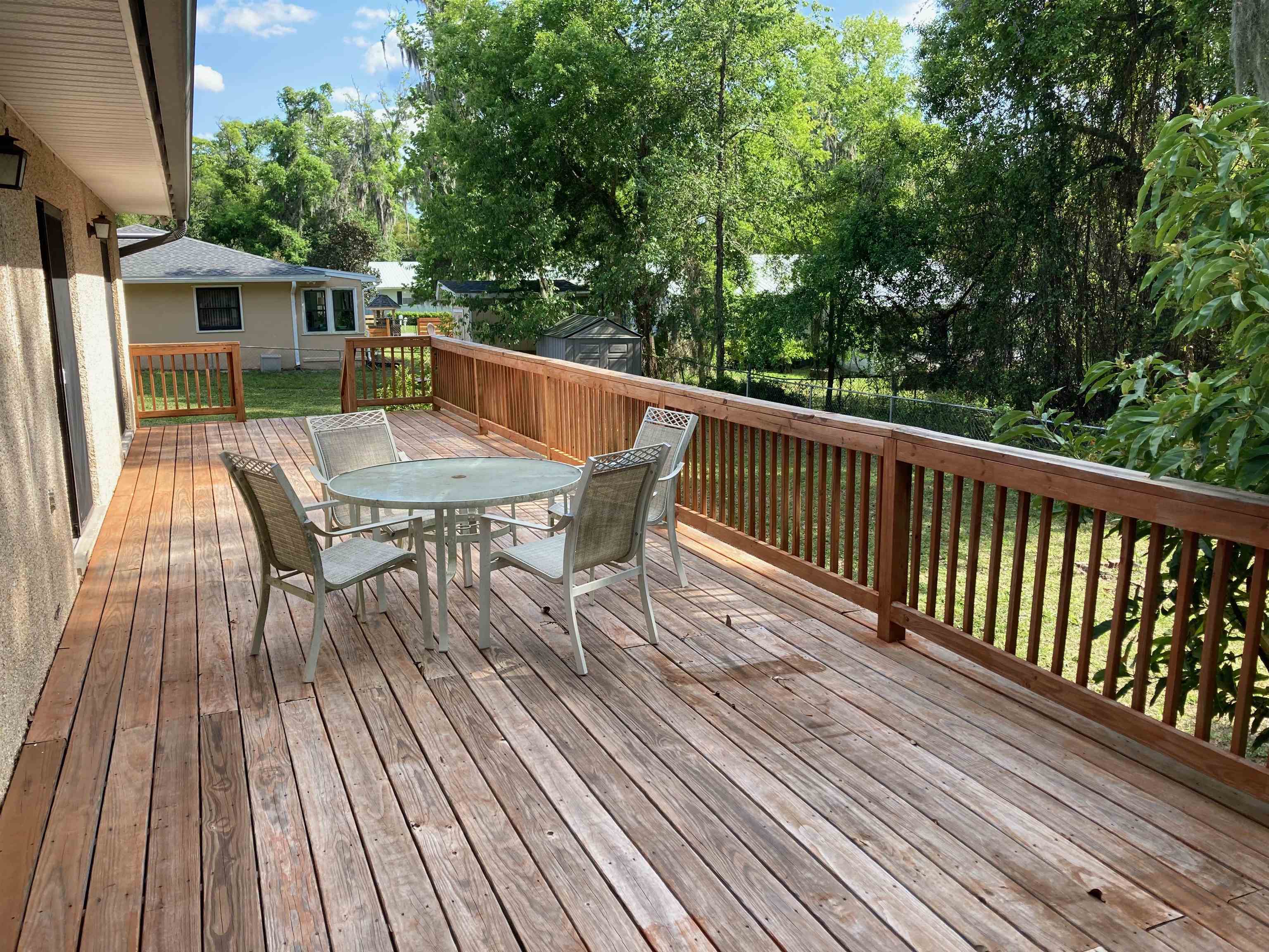 356 Cypress Road St. Augustine, FL 32086 - Photo 33 of 40 a roof deck with wooden floor and fence