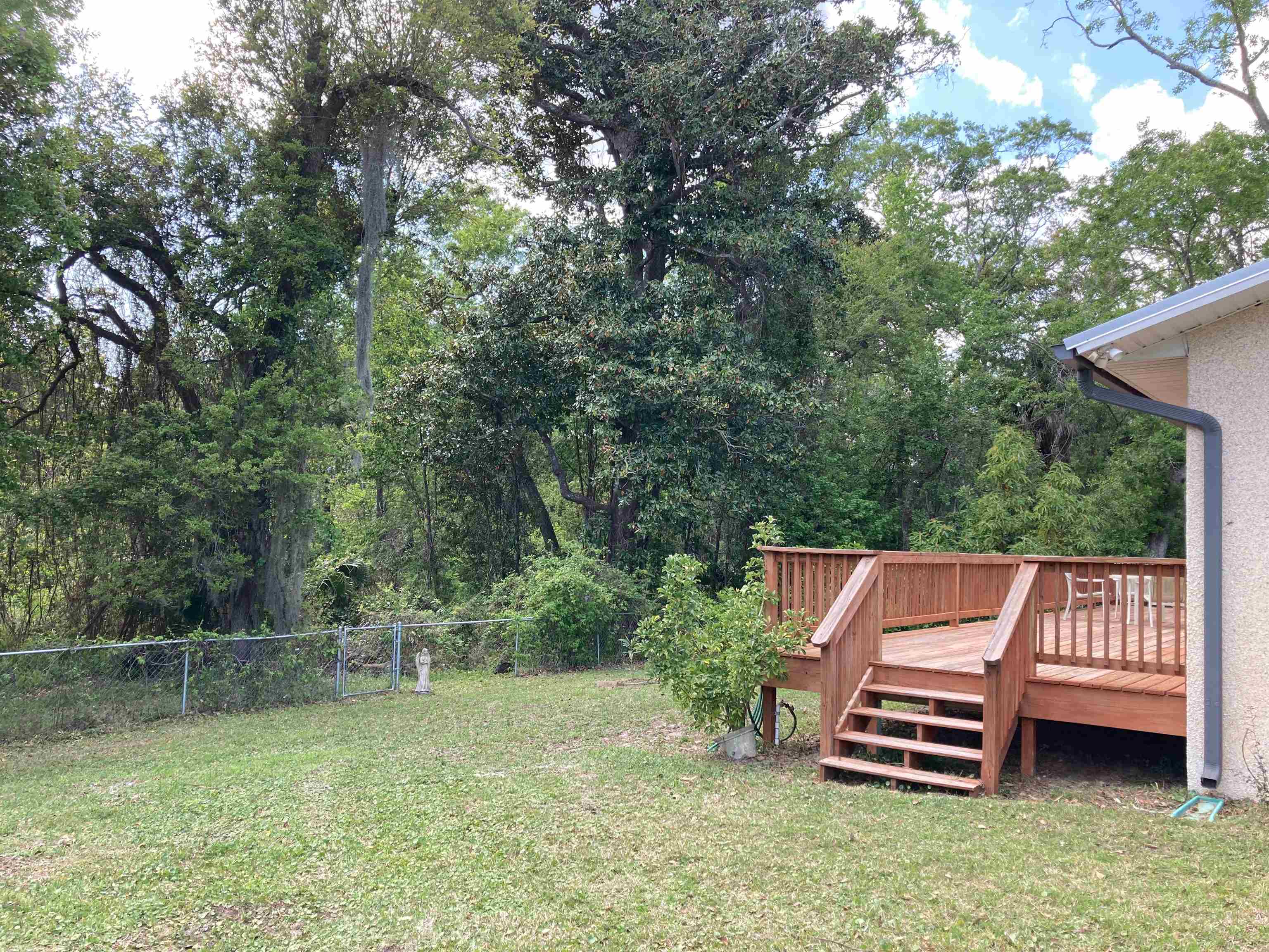 356 Cypress Road St. Augustine, FL 32086 - Photo 35 of 40 a view of a wooden deck with a yard