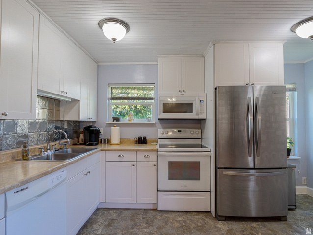 155 West Center Street Fillmore, UT 84631 - Photo 23 of 86 Kitchen featuring white cabinetry, light-toned countertops, a stainless steel French door refrigerator, a white electric range, and a built-in microwave