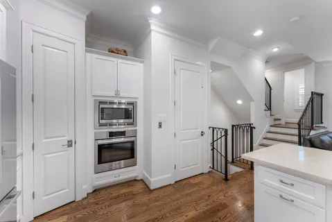 a bedroom with a bed and large window