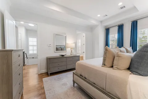 a bathroom with a granite countertop sink and a bathtub
