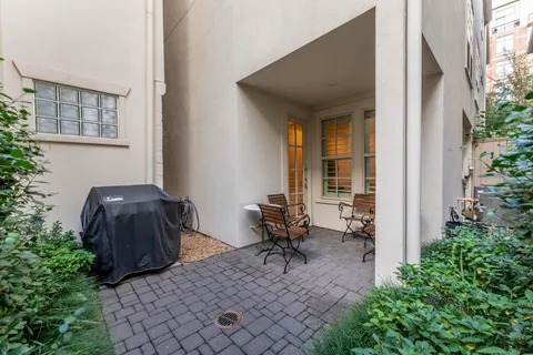 a view of a pathway with a garden