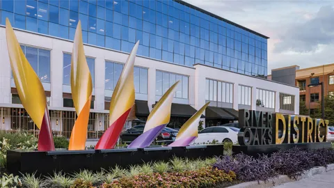 a view of a street with brick building in front of it