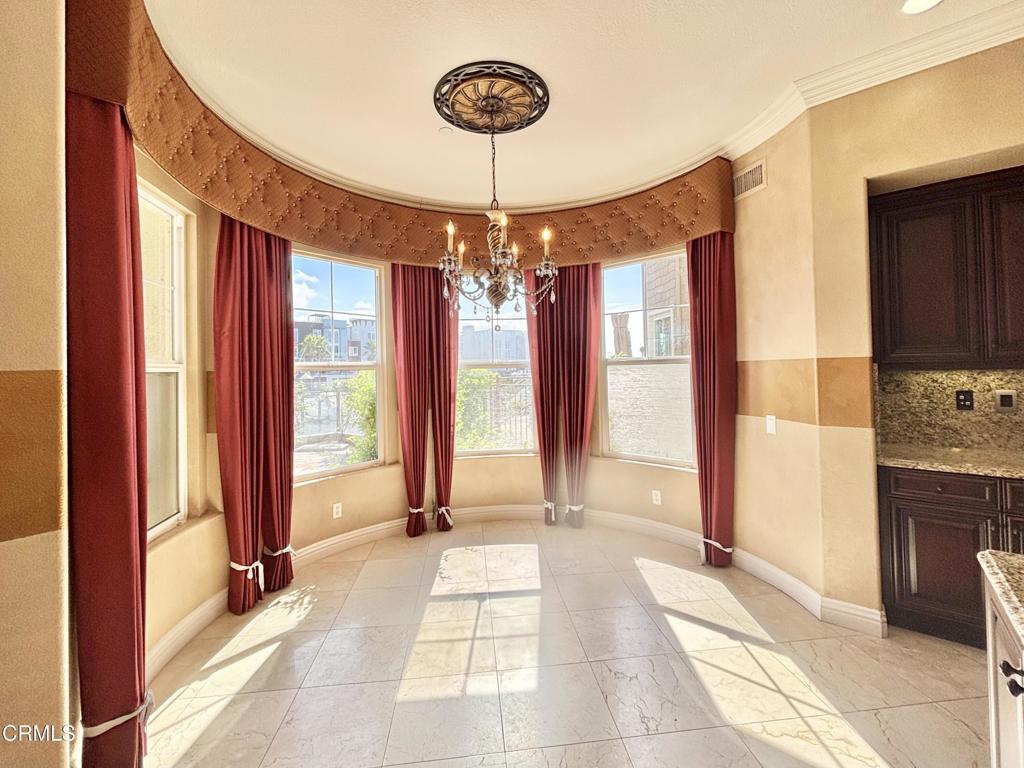 1702 Aleutian Way Oxnard, CA 93035 - Photo 19 of 73 a very nice looking room with a large window and chandelier