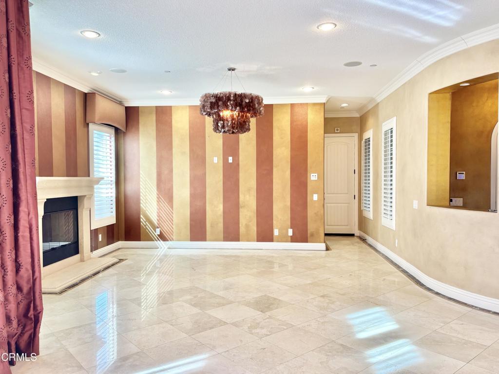 1702 Aleutian Way Oxnard, CA 93035 - Photo 34 of 73 a view of an empty room with a fireplace and a window