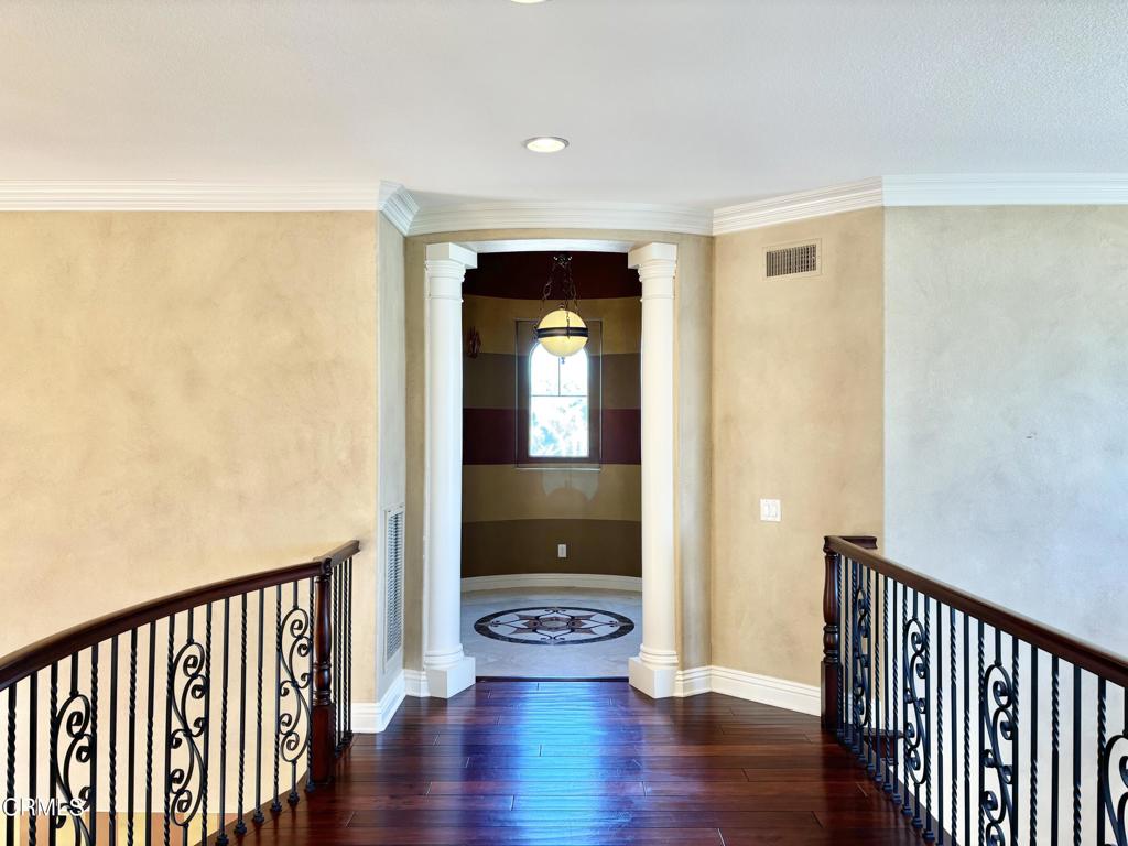 1702 Aleutian Way Oxnard, CA 93035 - Photo 37 of 73 a view of an empty room with wooden floor and a window