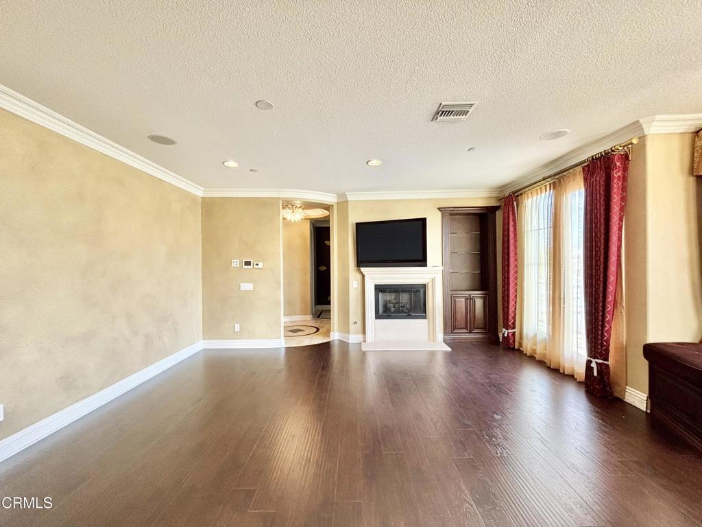 1702 Aleutian Way Oxnard, CA 93035 - Photo 40 of 73 a view of an empty room with wooden floor and a window