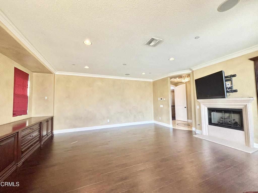 1702 Aleutian Way Oxnard, CA 93035 - Photo 41 of 73 a view of an empty room with a fireplace and a window