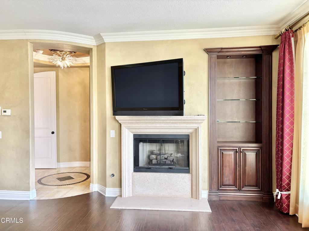 1702 Aleutian Way Oxnard, CA 93035 - Photo 42 of 73 a living room with a fireplace and a flat screen tv