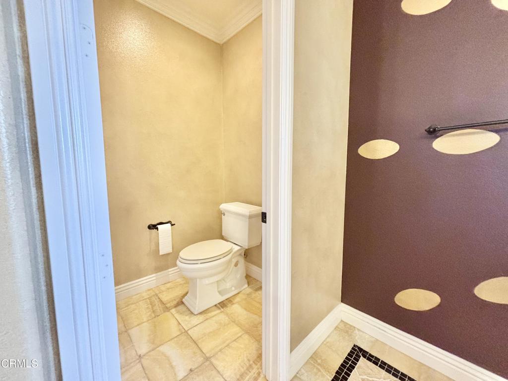 1702 Aleutian Way Oxnard, CA 93035 - Photo 46 of 73 a bathroom with a granite countertop sink and a mirror