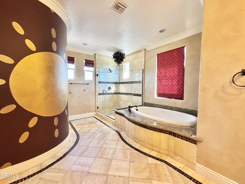 1702 Aleutian Way Oxnard, CA 93035 - Photo 47 of 73 a bedroom with a bed and a painting on the wall