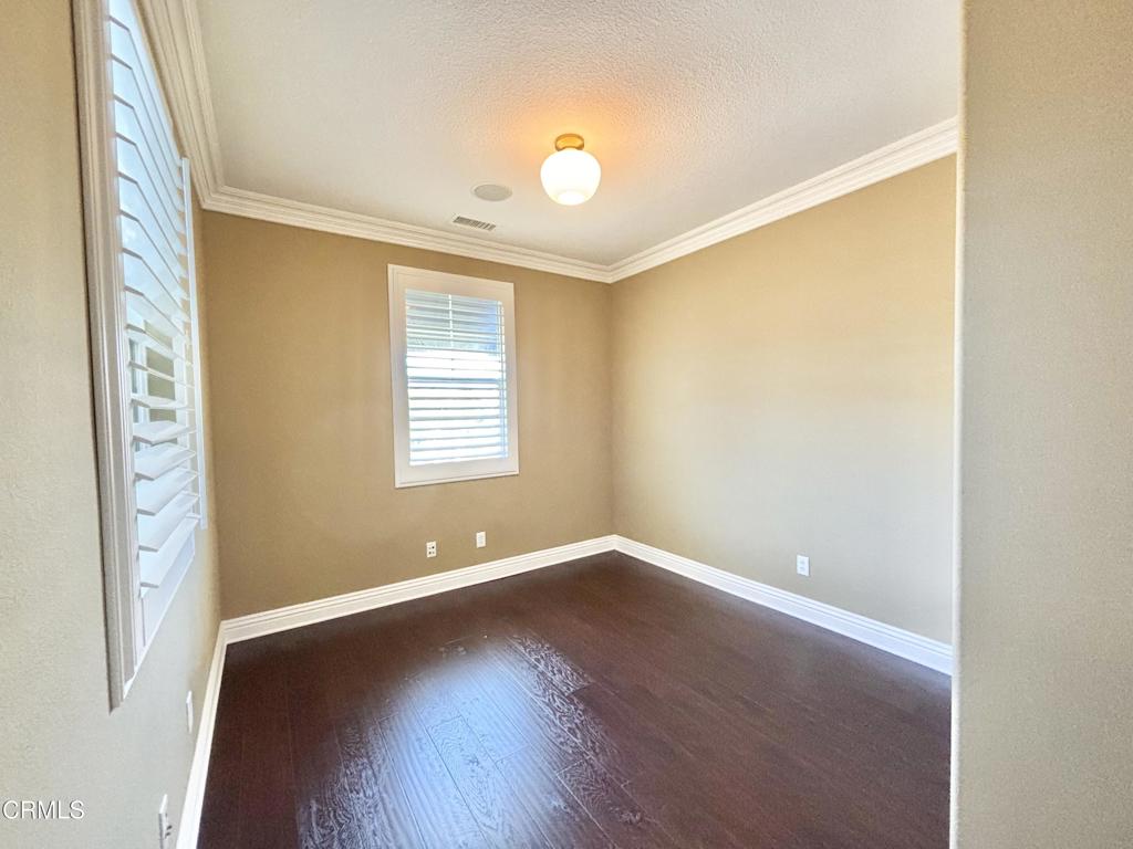 1702 Aleutian Way Oxnard, CA 93035 - Photo 49 of 73 an empty room with wooden floor and windows