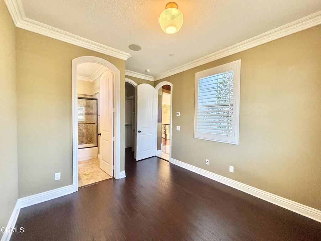1702 Aleutian Way Oxnard, CA 93035 - Photo 52 of 73 an empty room with wooden floor and windows