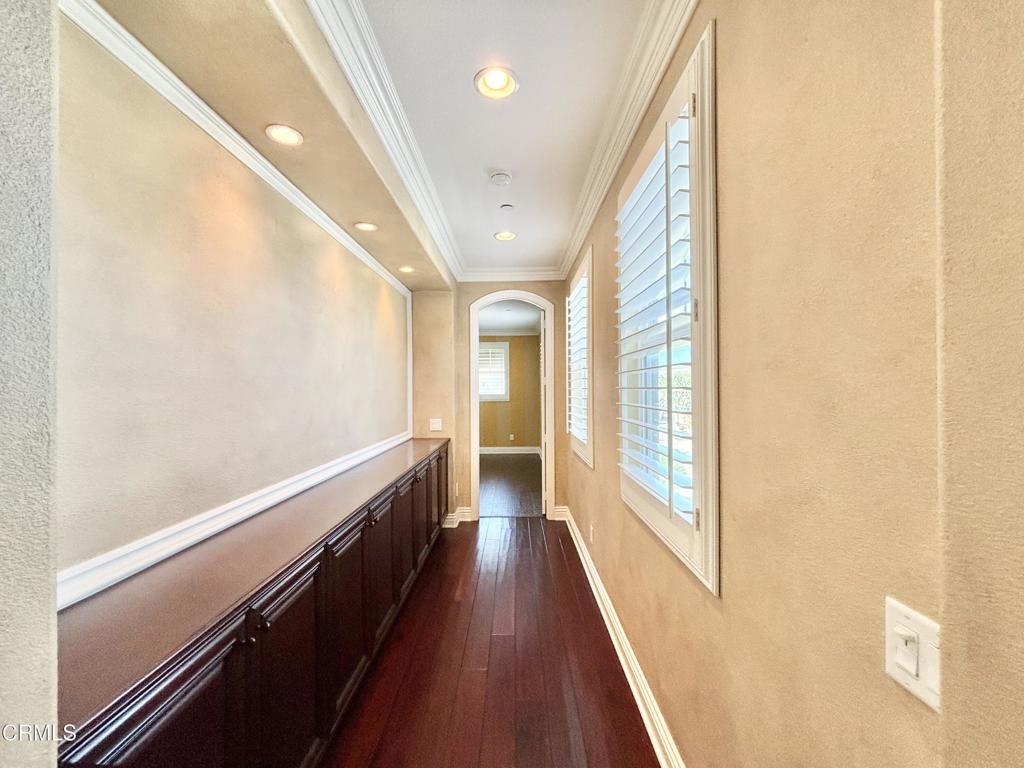 1702 Aleutian Way Oxnard, CA 93035 - Photo 53 of 73 a view of a hallway with wooden floor