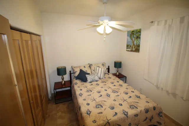 a bathroom with a shower and a glass door