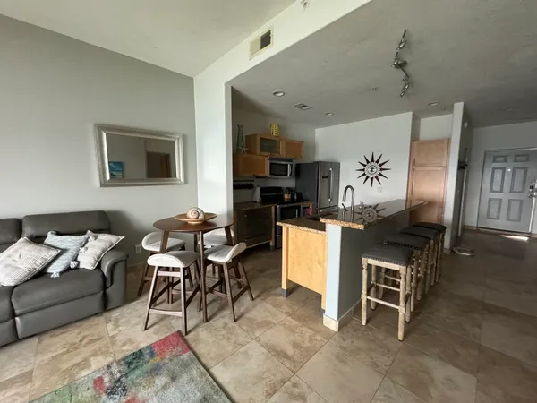 a dining room with furniture and window