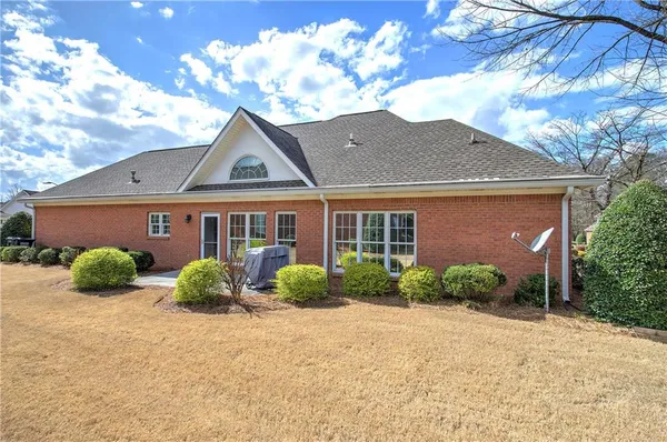 a front view of a house with garden