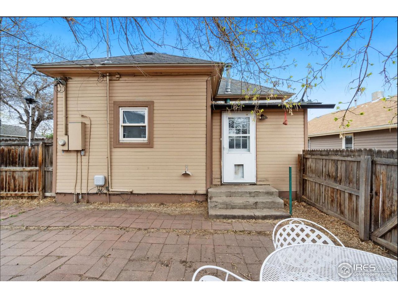 21 Main Street Windsor, CO 80550 - Photo 11 of 12 a view of a house with wooden fence