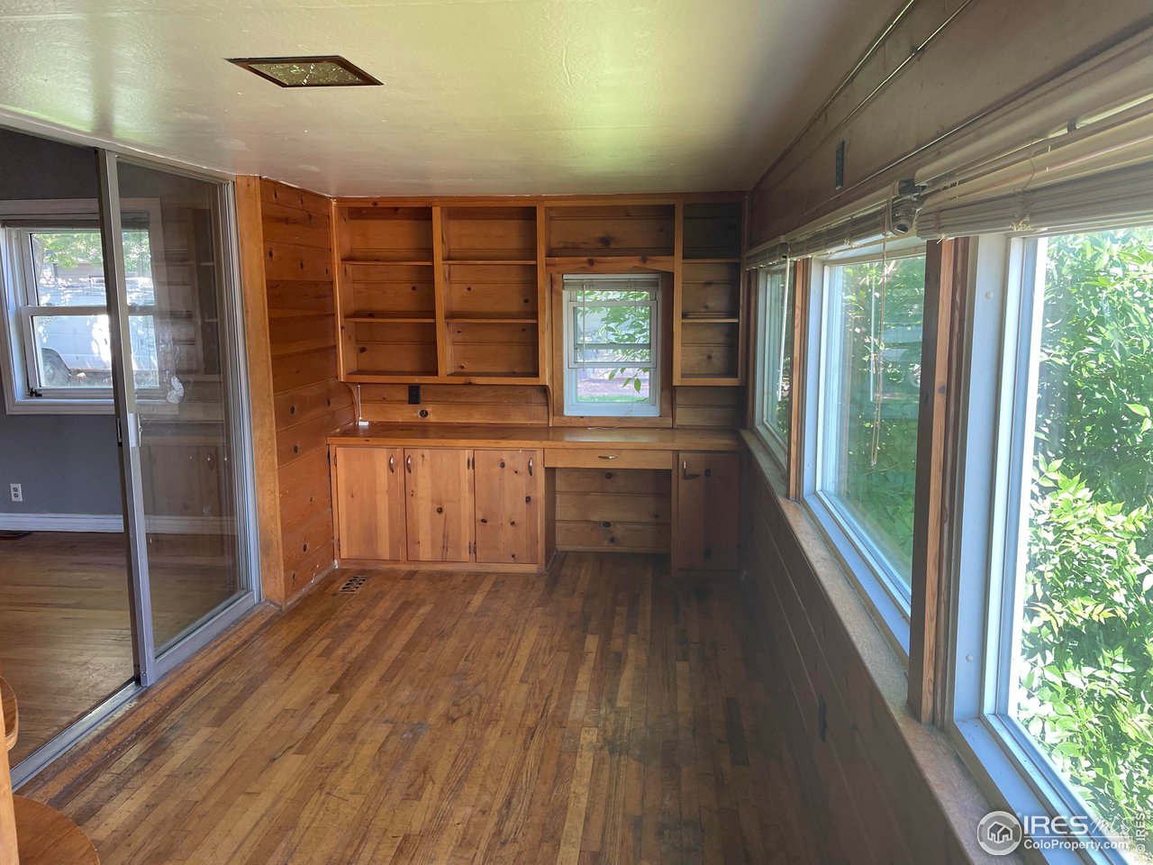 21 Main Street Windsor, CO 80550 - Photo 3 of 12 a view of a kitchen with a sink and dishwasher wooden floor