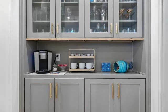 a view of two windows and a kitchen