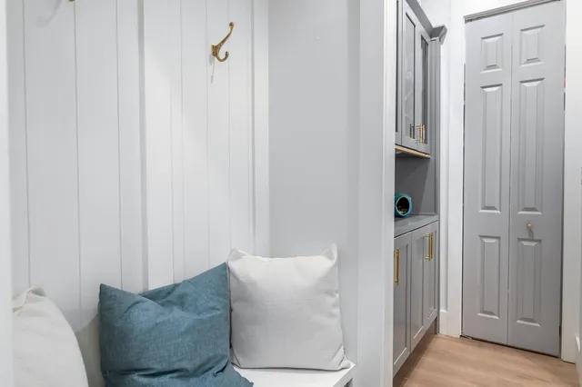 a living room with furniture and a gate