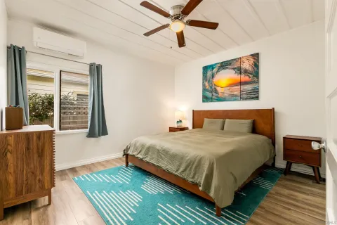 a bedroom with bed and window