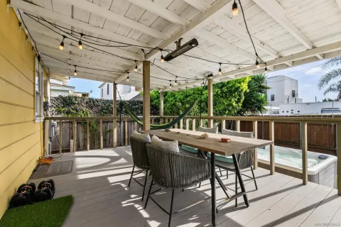 a view of a patio with a table and chairs