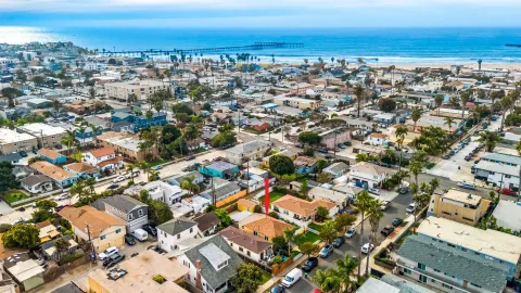an aerial view of residential building and ocean