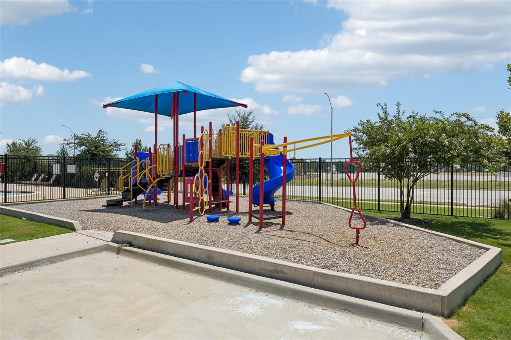 2508 Red Draw Road Fort Worth, TX 76177 - Photo 32 of 38 Playground area featuring a slide, climbing structures, and protective surfacing