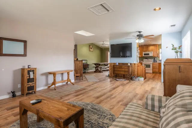 a living room with furniture a window and a fireplace